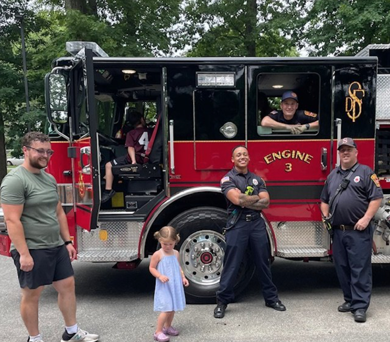 Community members gathered with Springfield Fire Engine 3 at an East Forest Park event